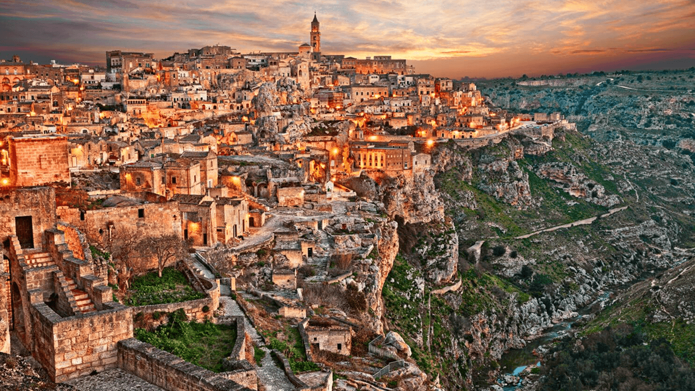 Ancient cave dwellings at sunset
